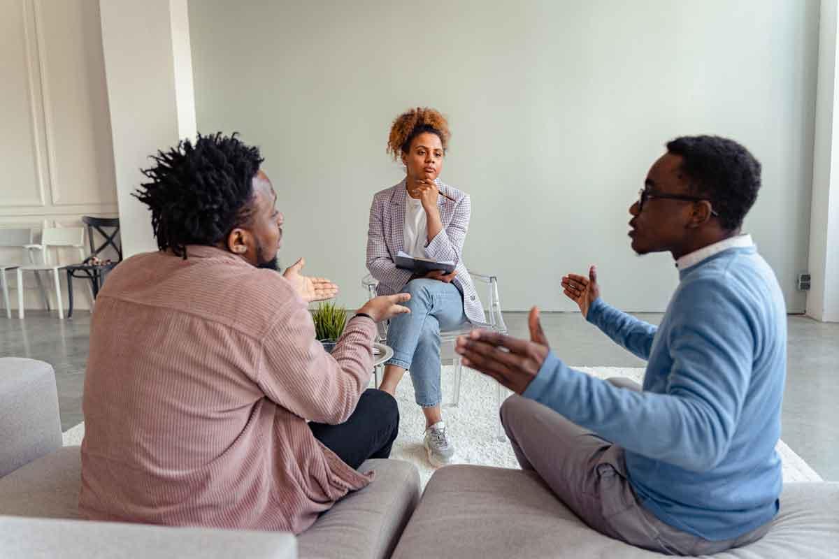 couple arguing in front of therapist